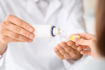 Ophthalmologist working with patient in clinic