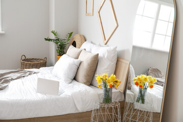 Stylish mirror in interior of bedroom