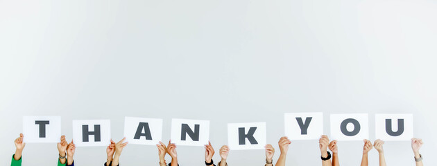 Studio shot of unrecognizable unidentified group of staff officer in corporate office holding thank...