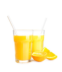 Glasses of tasty orange juice on white background