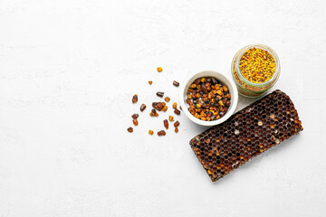 Beebread and pollen with honeycomb on white background