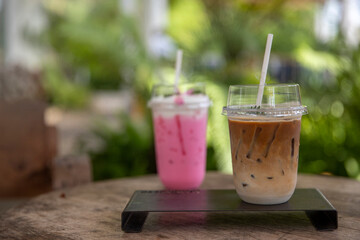 Ice latte coffee in take away  and blurred  Cold milk smoothie  milkshake with  nature background.