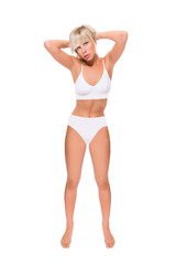 Fototapeta premium Full length portrait of a beautiful blonde woman wearing a white bikini, studio photo isolated in front of white background