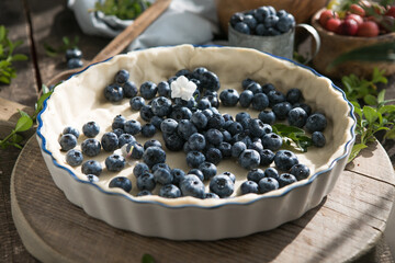Homemade pastry blueberry  pie pies bakery products on dark wooden kitchen table . Traditional dessert on Independence Day. Flat lay food background. Top view