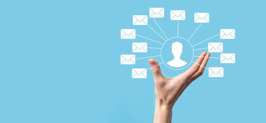 Male hand holding letter icon,email icons .Contact us by newsletter email and protect your personal information from spam mail. Customer service call center contact us.Email marketing and newsletter
