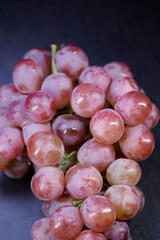 bunch of fresh grapes isolated on black background
