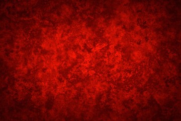 Abstract background in red colors with shaded edges. Marbled noisy texture.