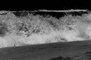 Arabian Ocean waves with foam of blue and turquoise color. Sea foam creating amazing shapes and patterns like glacier. Abstract Arabian Ocean blue water with white wave for background.