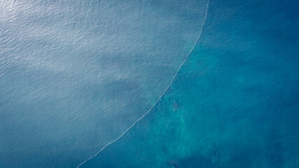 Aerial drone view of beautiful sea wave surface in the sunrise