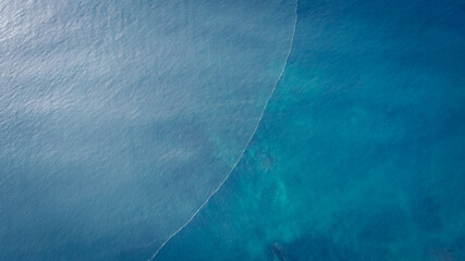 Aerial drone view of beautiful sea wave surface in the sunrise