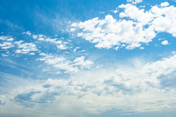 Stunning view of a blue sky with some clouds during a sunny day. Natural background with copy space