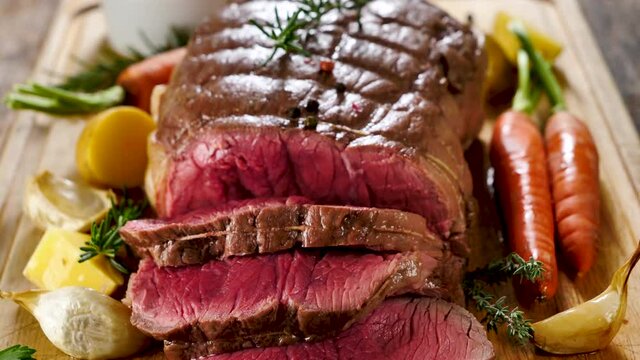 roasted beef slice on board