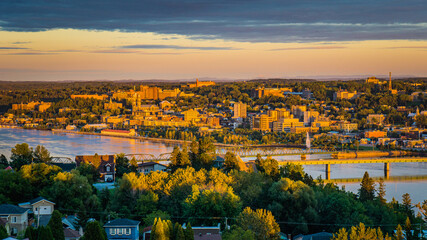 Colorful sunset and cloudy sky over the city of Chicoutimi in Quebec (Canada)