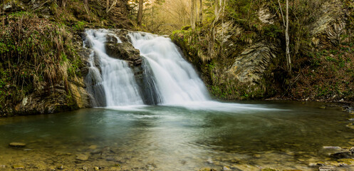 Fototapeta na wymiar Hurkalo waterfall in carpathian forest