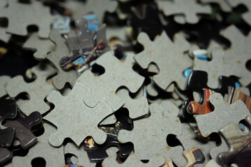 jigsaw puzzle on wooden background. to represent how complexity in game and challenge. plan and goal as concept.	
