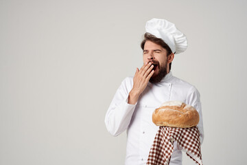 Baker with bread in hand culinary industry