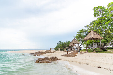 Nature in twilight period which including of sunrise over the sea and the nice beach. Summer beach with blue water and purple sky at the sunset.	

