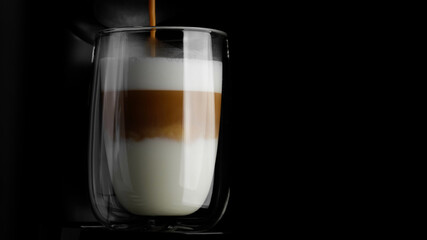 Cappuccino. Black coffee pouring in milk. Layers of cappuccino. Process making cappuccino or latte