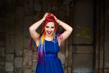 Cheerful young woman with rainbow hair