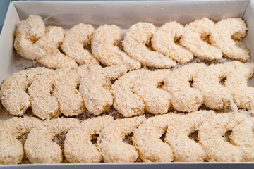 open box with frozen shrimp in batter. semi-finished products for deep frying. 