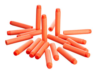 Scattering of orange plastic toy cartridges for pneumatic weapons with a soft tip, isolated on a white background. - 452119339