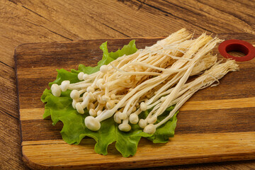 Raw Enoki mushrooms for cooking