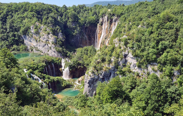 Beautiful waterfalls and lakes in mountains in a national park in Croatia on a summer sunny day