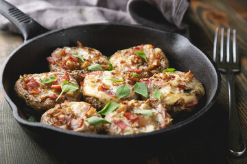 Baked mushrooms stuffed with cheese and bacon