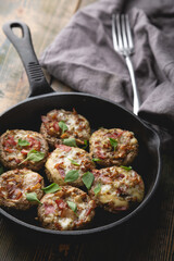 Baked mushrooms stuffed with cheese and bacon