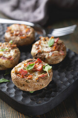 Baked mushrooms stuffed with cheese and bacon