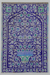 Closeup view of traditional blue and white ceramic tiles panel with floral motif on wall of Makhdum Nuh tomb in Hala, Sindh, Pakistan - obrazy, fototapety, plakaty
