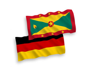 National vector fabric wave flags of Germany and Grenada isolated on white background. 1 to 2 proportion.