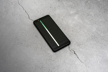 smartphone with a damaged screen with a color stripe. burnt out pixels.