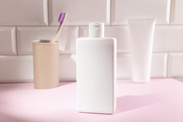 White cosmetic bottles in a bathroom, mock up for your design. Eco friendly concept