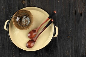 Top View Handmade ceramic Plate and Bowl with Two Wooden Spoon