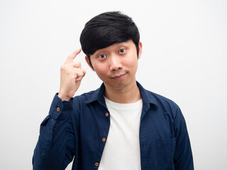 Young man point finger at his head gesture thinking portrait white background