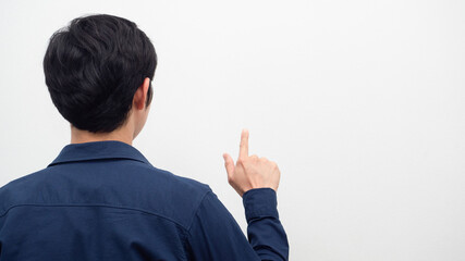 Man turn back show finger gesture touch screen at copy space white background