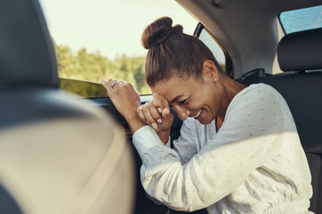 Passenger having fun at the back seat of car