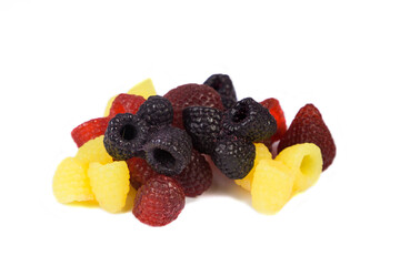 A bunch of exclusive handmade soap in the form of bright raspberries and blackberries on a white background. Isolated