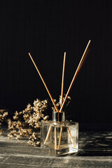 aromatic reed diffuser glass bottle on a light background