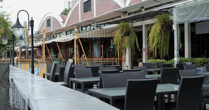 Restaurant fronts closed due Coronavirus Pandemic lockdown, empty tables and chairs in the bar restaurant, Economic downturn.