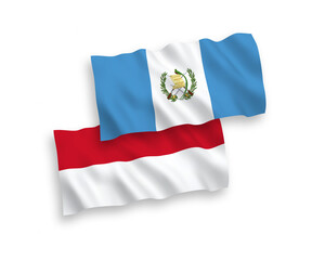 National vector fabric wave flags of Indonesia and Republic of Guatemala isolated on white background. 1 to 2 proportion.