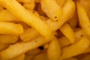 French fries on a plate, close-up, selective focus.