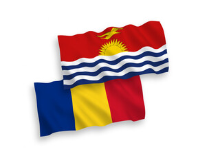 National vector fabric wave flags of Romania and Republic of Kiribati isolated on white background. 1 to 2 proportion.