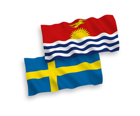 National vector fabric wave flags of Sweden and Republic of Kiribati isolated on white background. 1 to 2 proportion.