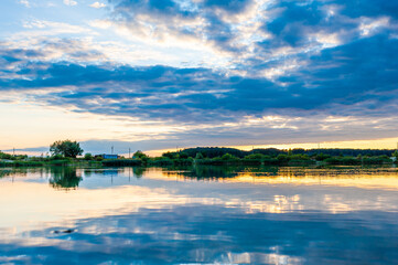 Fototapeta na wymiar Beautiful calm lake with sunset