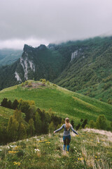 Fototapeta na wymiar Woman traveling alone enjoying foggy mountains view hiking adventure vacations outdoor healthy lifestyle active trip