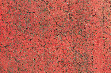 Red paint cracked road texture