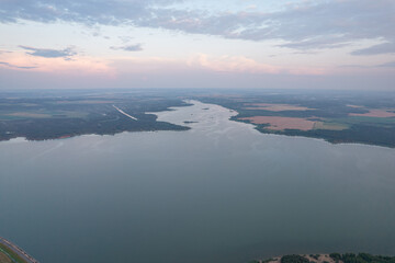 Fototapeta na wymiar Landscape with a reservoir (Vileika reservoir) and forest spaces 