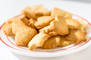 Homemade butter cookies on a dish in beautiful sunlight